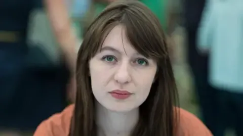 Sally Rooney claims she will not visit the UK due to potential arrest